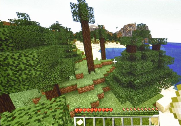 Minecraft gameplay view: blocky oak forest terrain, sandy beach and open water under a bright sky, with the game's hearts and hotbar shown at the bottom